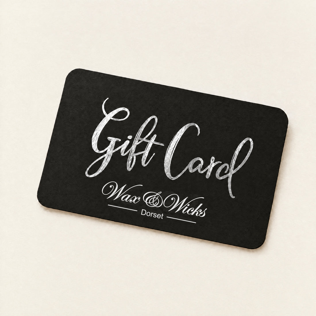 Black Dorset Wax & Wicks gift card with the words Gift Card in silver script
