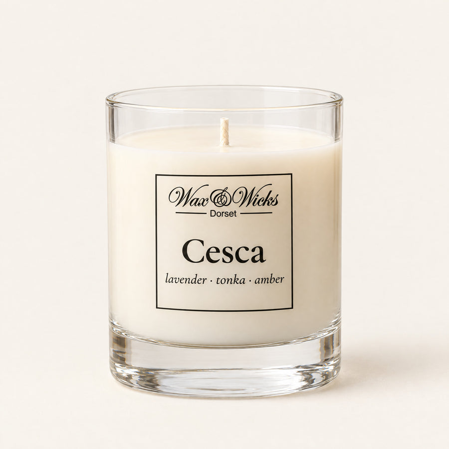 Small Cesca candle, one wick, in a clear glass jar, on a plain ivory background