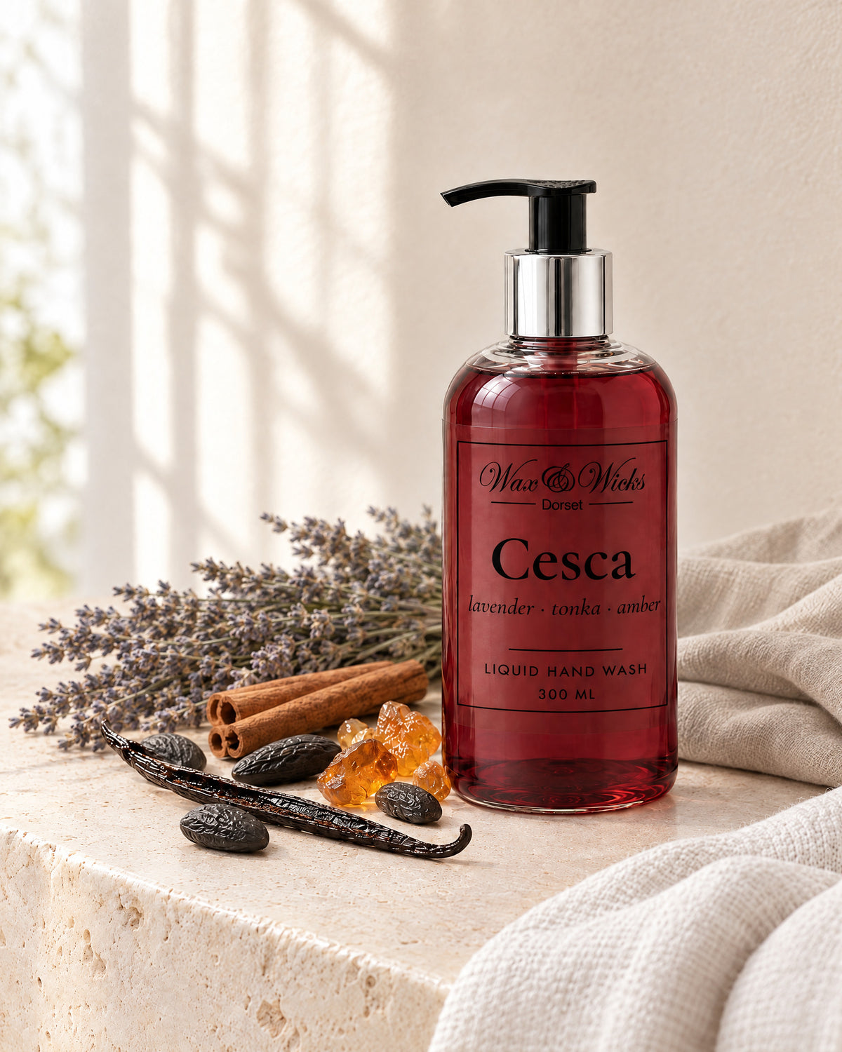 Cesca liquid hand wash, 300 ml pump bottle, styled with dried lavender, tonka beans, cinnamon sticks, a vanilla pod and amber resin