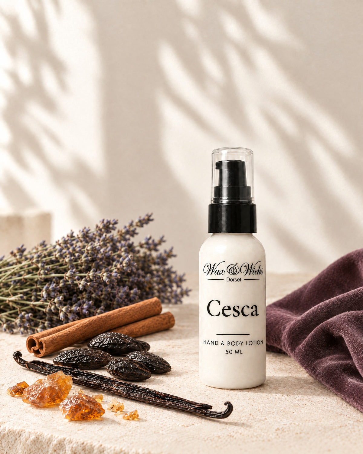 Cesca hand & body lotion, 50 ml bottle, styled with dried lavender, tonka beans, cinnamon sticks, a vanilla pod and amber resin