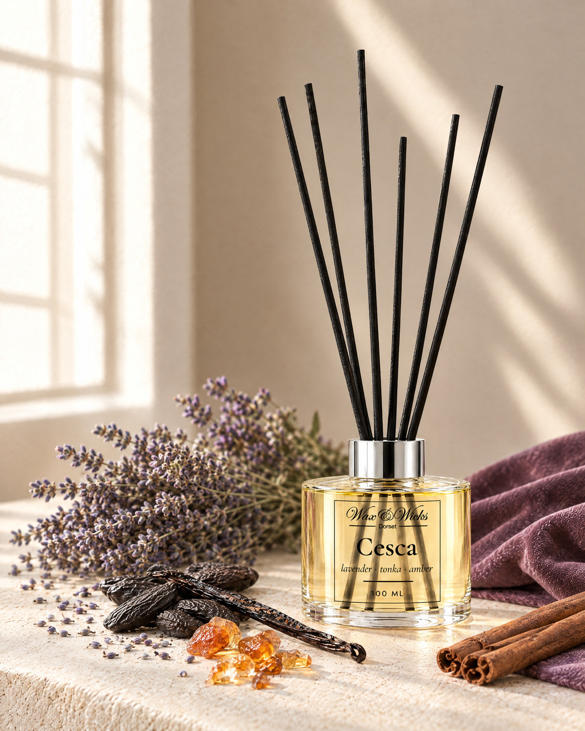 Cesca 100 ml reed diffuser with black fibre reeds, styled with dried lavender, tonka beans, cinnamon sticks, a vanilla pod and amber resin