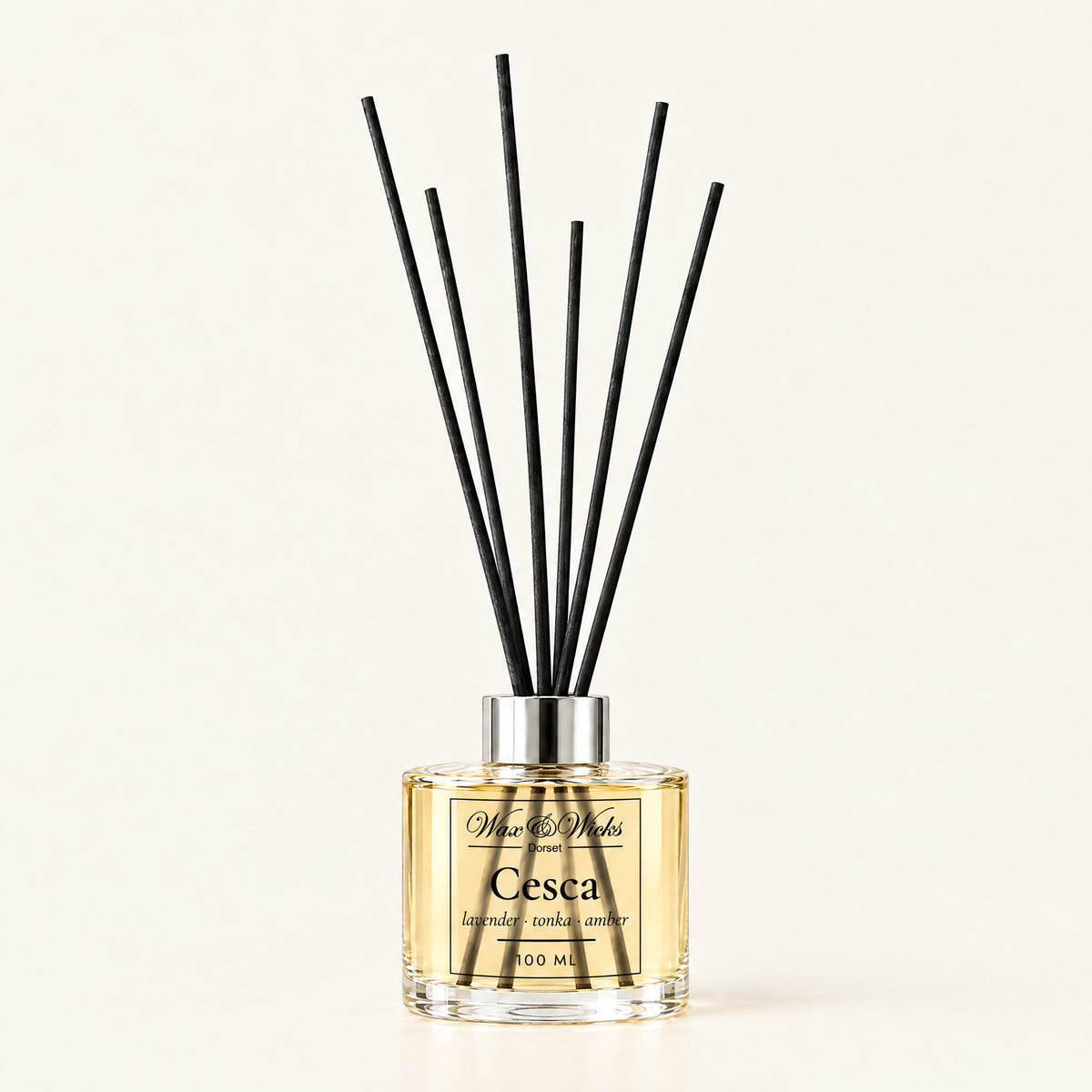 Cesca 100 ml reed diffuser with black fibre reeds, on a plain ivory background