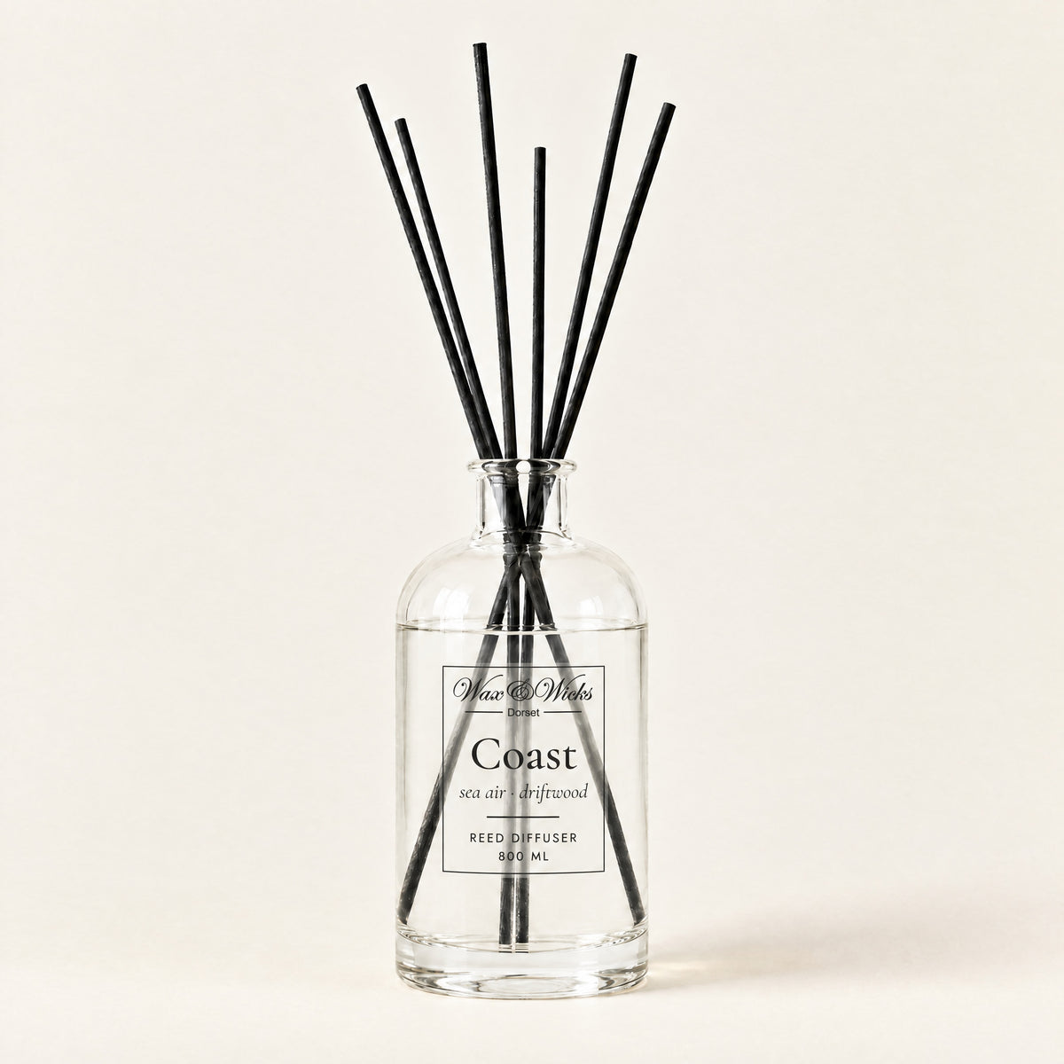 Coast 800 ml large reed diffuser in apothecary-style glass with extra-long reeds, on a plain ivory background