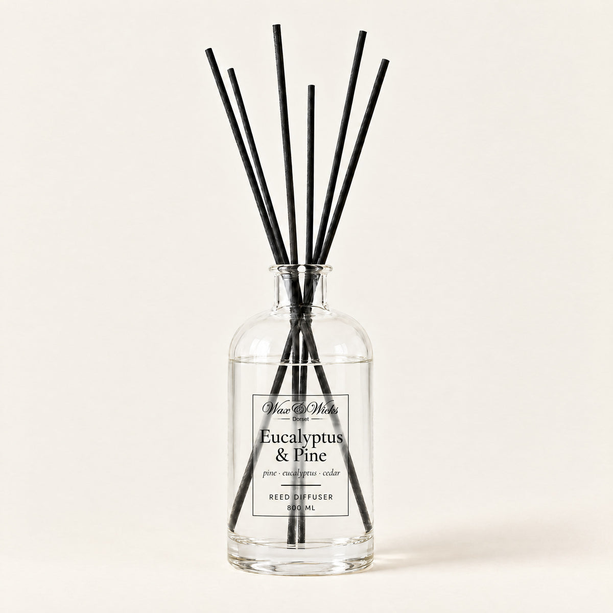 Eucalyptus & Pine 800 ml large reed diffuser in apothecary-style glass with extra-long reeds, on a plain ivory background