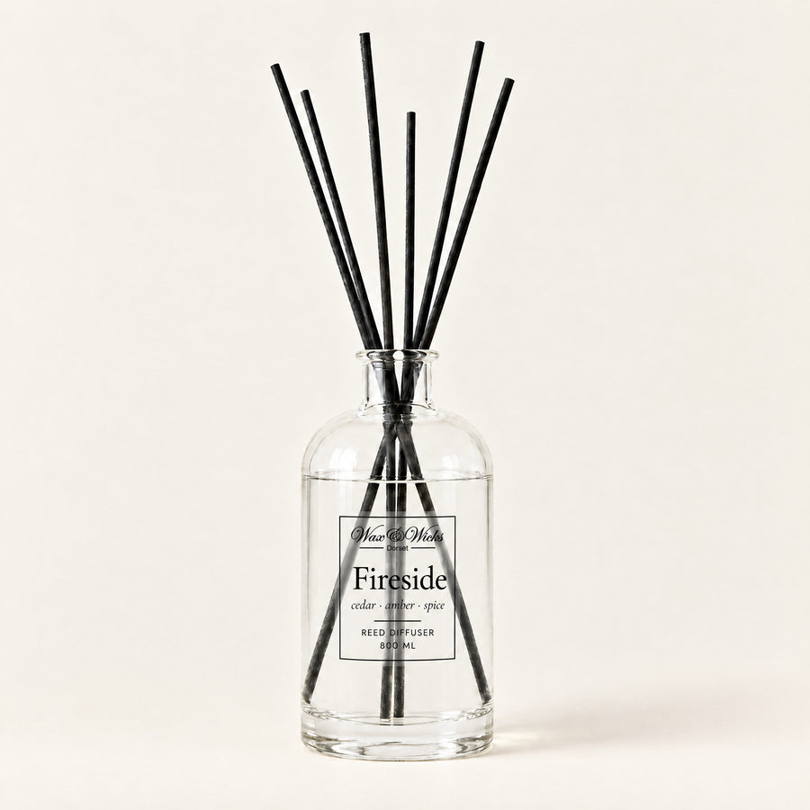 Fireside 800 ml large reed diffuser in apothecary-style glass with extra-long reeds, on a plain ivory background