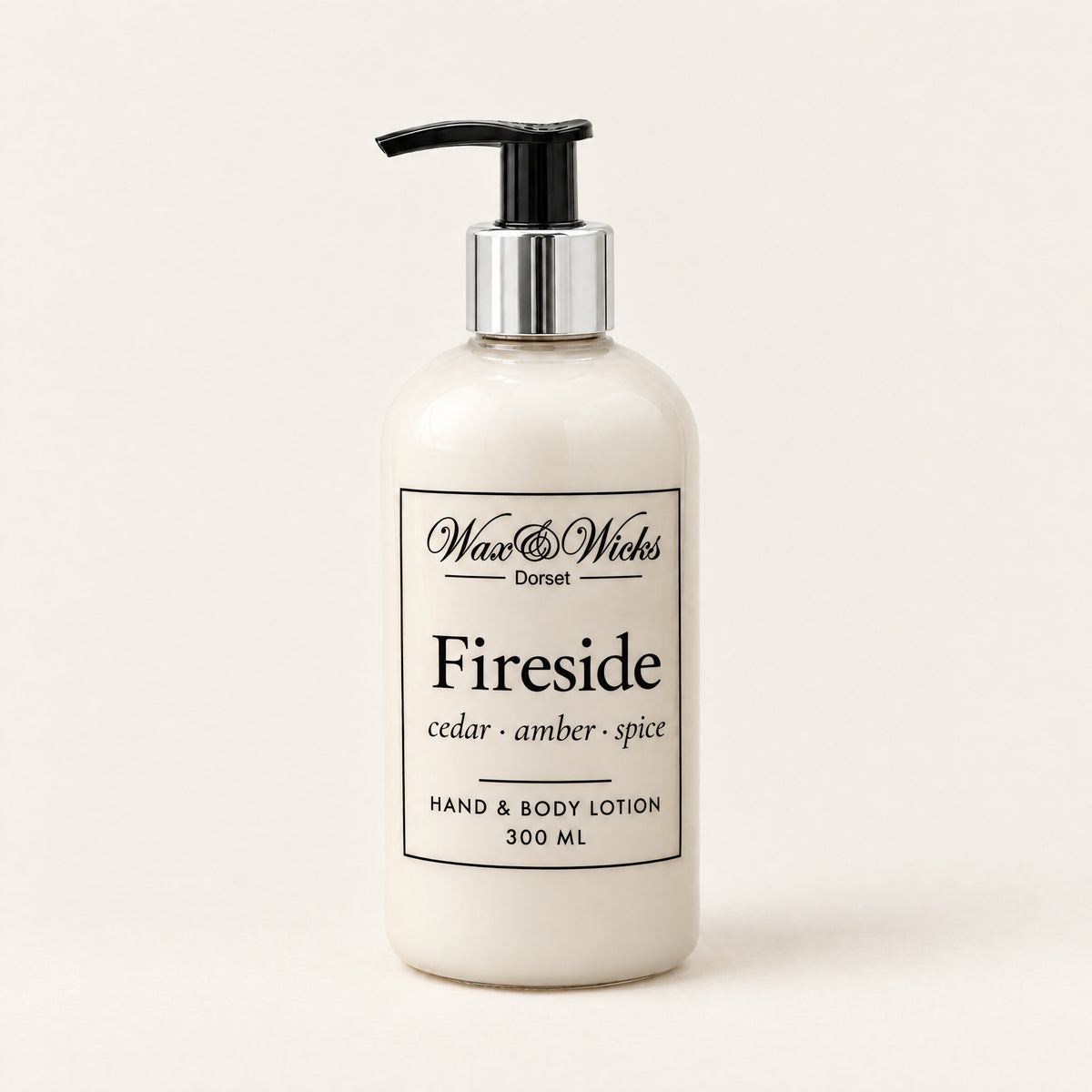 Fireside hand & body lotion, 300 ml pump bottle, on a plain ivory background
