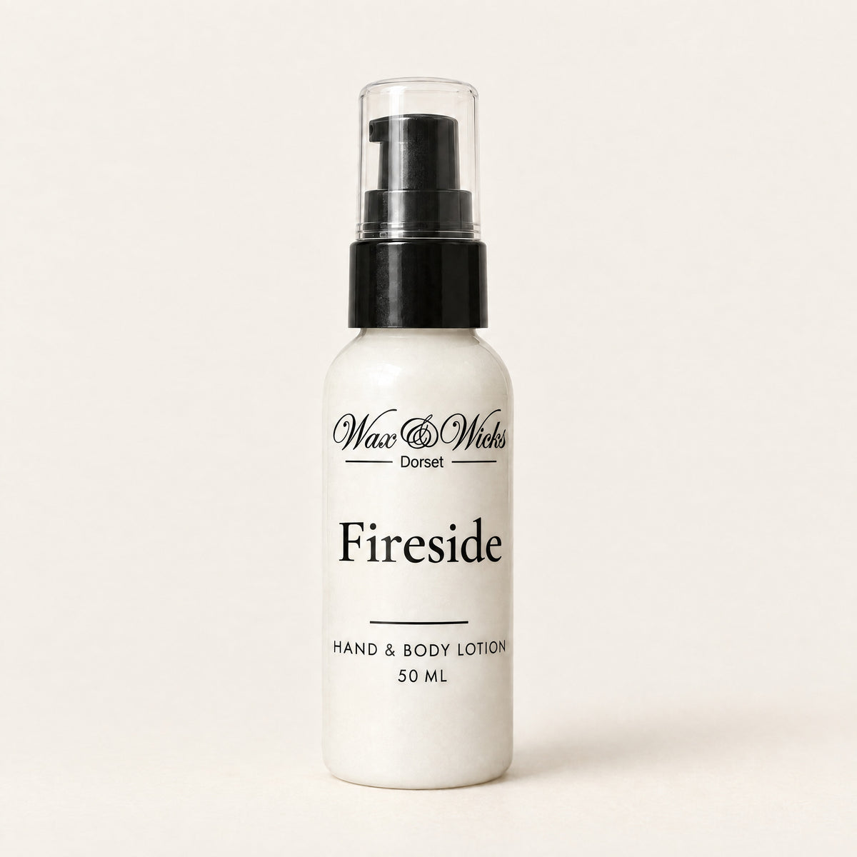 Fireside hand & body lotion, 50 ml bottle, on a plain ivory background