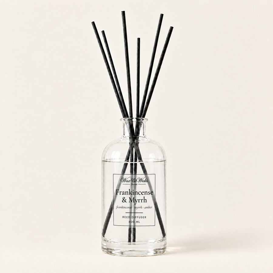 Frankincense & Myrrh 800 ml large reed diffuser in apothecary-style glass with extra-long reeds, on a plain ivory background