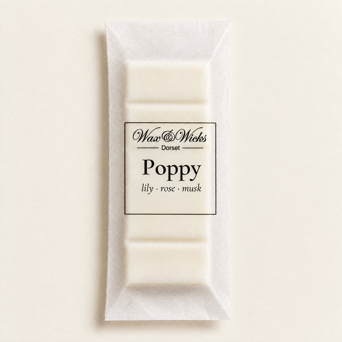 Poppy wax melt snap bar, on a plain ivory background