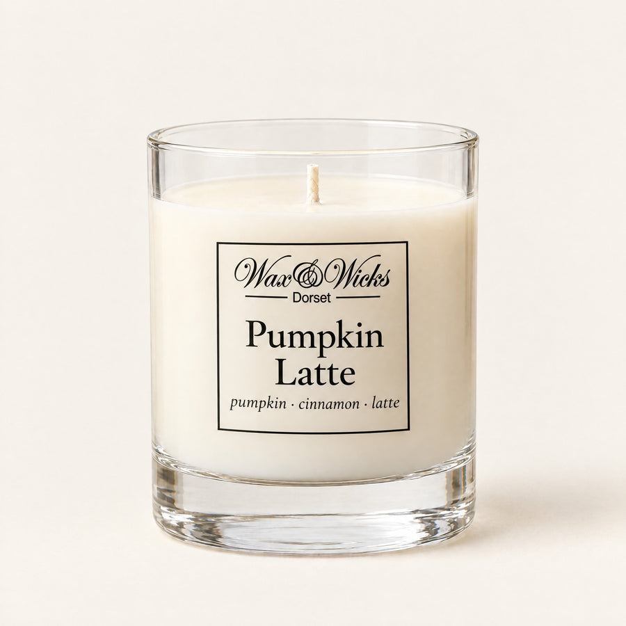 Small Pumpkin Latte candle, one wick, in a clear glass jar, on a plain ivory background