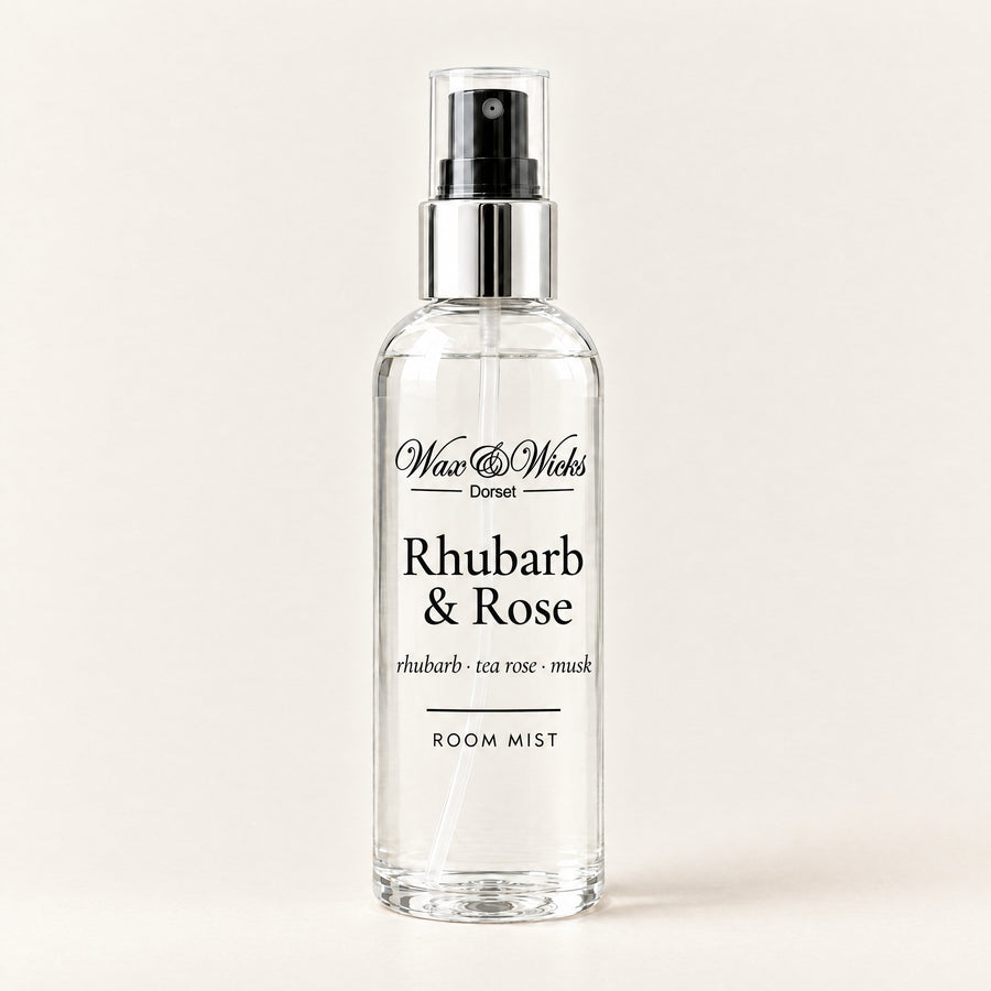 Rhubarb & Rose room mist, 100 ml spray bottle, on a plain ivory background