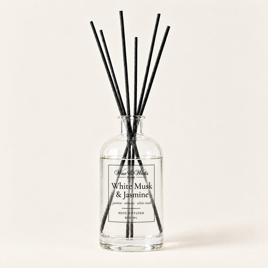 White Musk & Jasmine 800 ml large reed diffuser in apothecary-style glass with extra-long reeds, on a plain ivory background