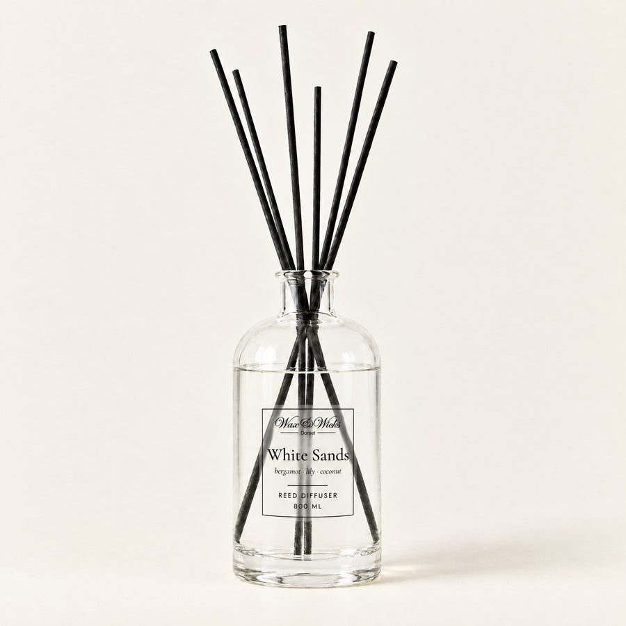 White Sands 800 ml large reed diffuser in apothecary-style glass with extra-long reeds, on a plain ivory background
