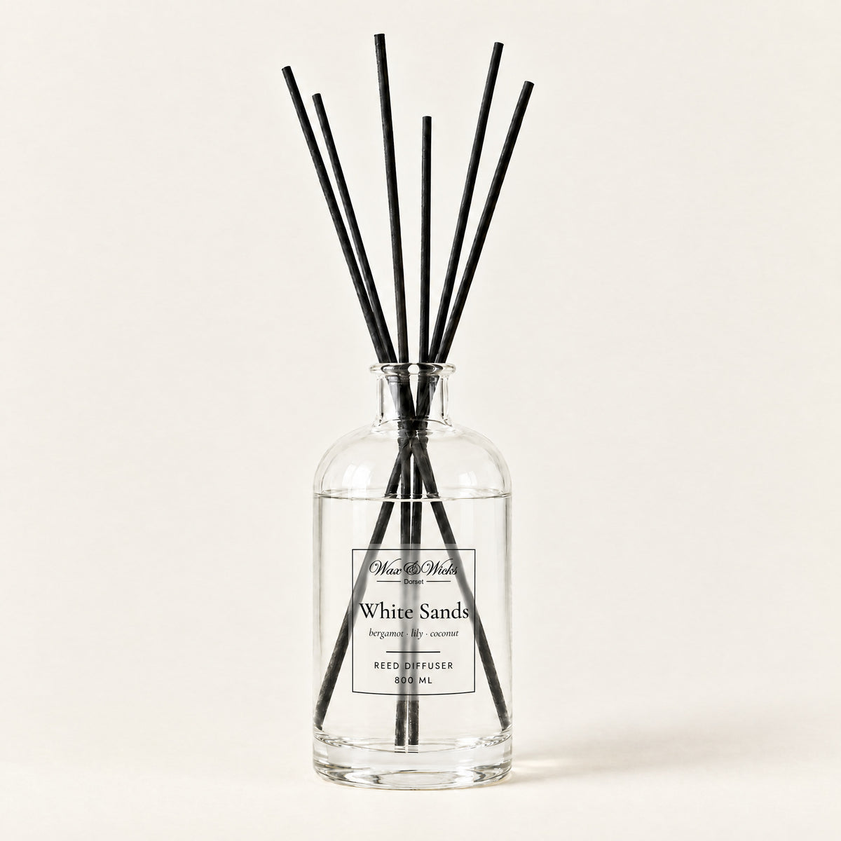 White Sands 800 ml large reed diffuser in apothecary-style glass with extra-long reeds, on a plain ivory background